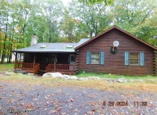 Charming Log Ranch Home on 2.54 Acres