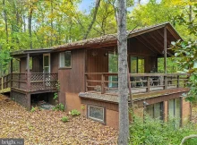 Discover your tranquil escape in this charming cabin nestled on over 5 acres of secluded land.  $189,900