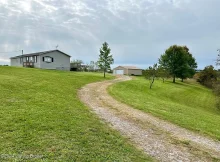 Affordable Mobile Home with addition and garage sitting on almost 6 acres within 1 mile of Taylorsville Lake’s Chowning Boat dock. $110,000