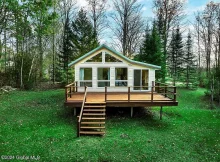 Discover your tranquil escape in this charming waterfront ranch home nestled in the heart of the Adirondacks. $250,000