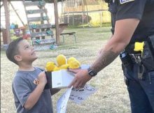 Police officer surprises 7-year-old boy selling lemonade with a pair of brand new sneakers for school