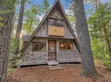 Discover your tranquil escape in this charming A-frame cabin nestled in the serene woods of Ossipee. $250,000